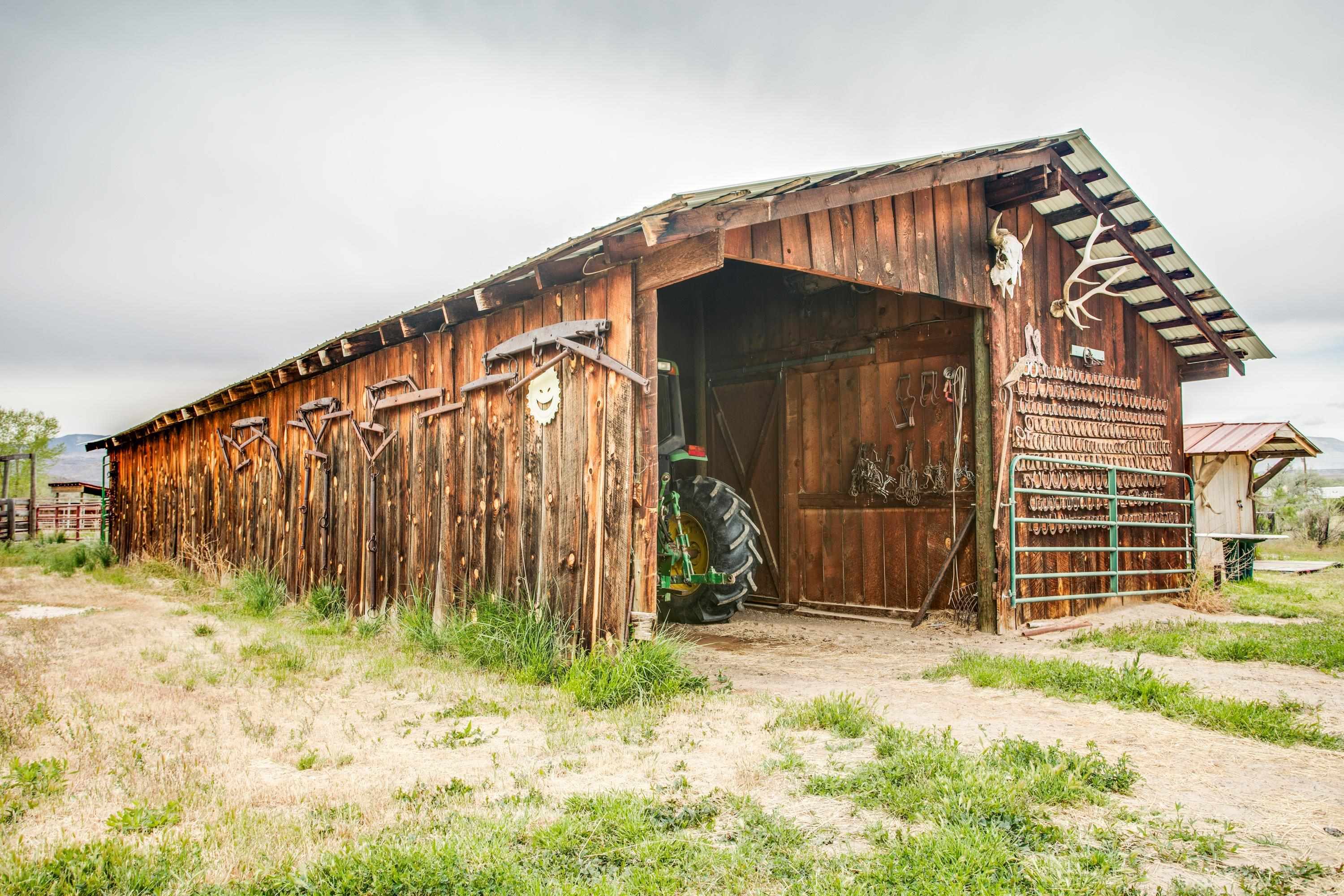 1951 I-70 B Frontage Road De Beque, CO 81630 - Photo 5 of 19 a view of a house with wooden fence