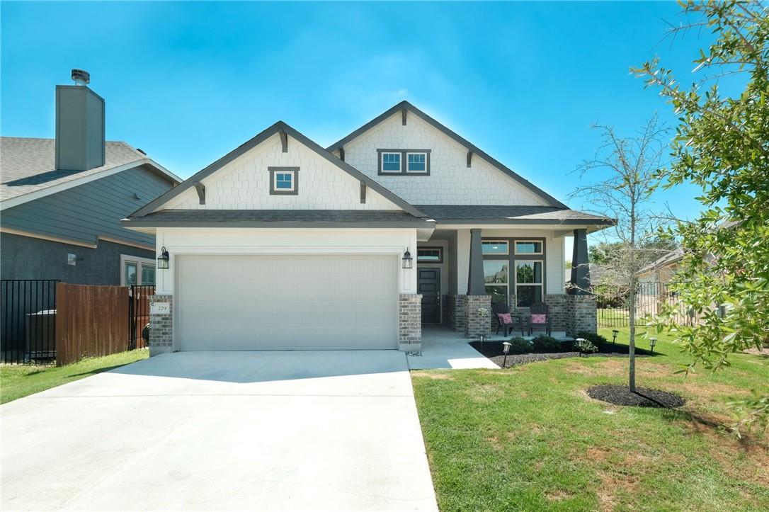 229 Bonnet Boulevard Georgetown, TX 78628 - Photo 7 of 20 Craftsman-style house featuring a porch, concrete driveway, and an attached garage