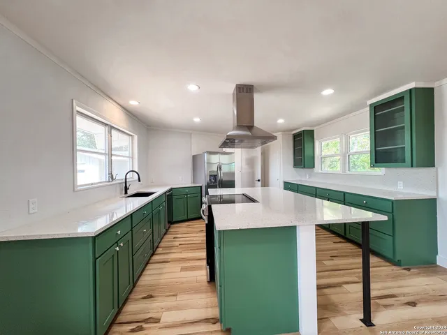 a kitchen with sink and window