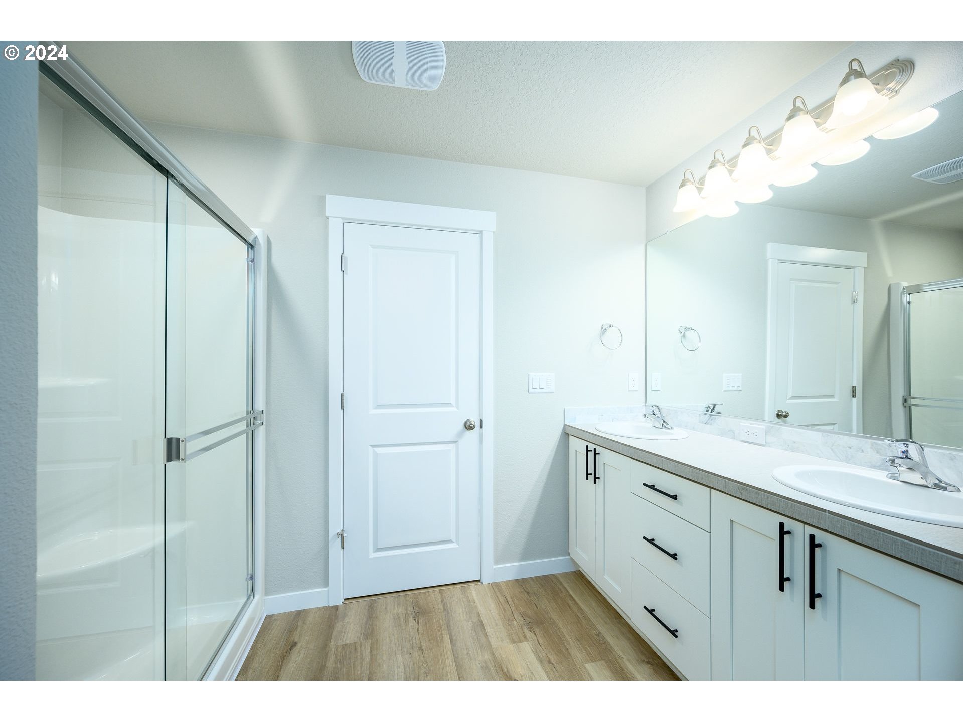 123 North 88th Drive, Unit 53 Ridgefield, WA 98642 - Photo 40 of 46 a bathroom with a double vanity sink mirror and double