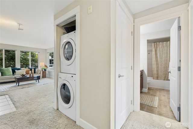 a view of a storage and utility room with washer and dryer