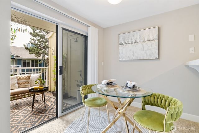 a view of a dining room with furniture window and wooden floor