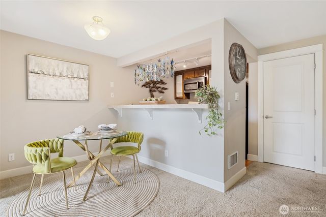 a view of a dining room with furniture