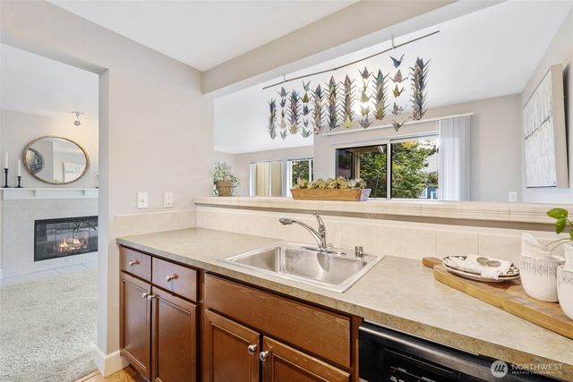 a kitchen with a sink and a stove