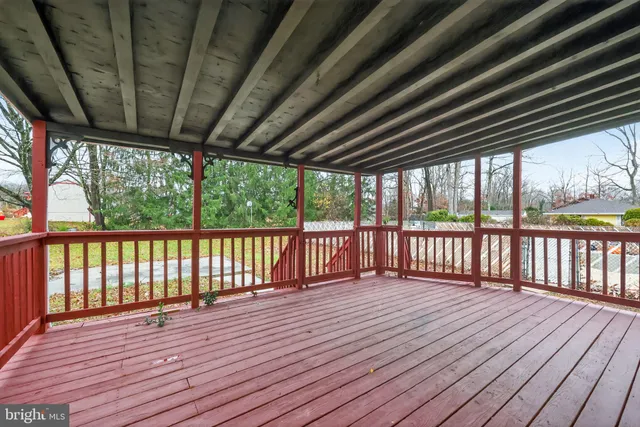 a view of a house with swimming pool and sitting area
