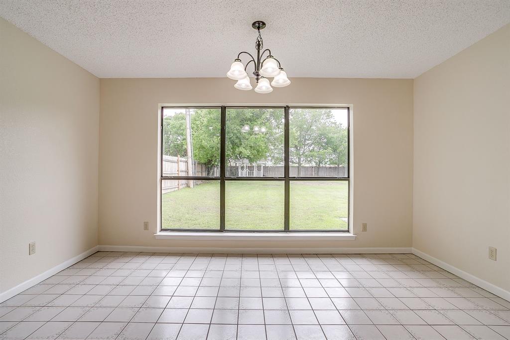 8613 Silver Creek Road White Settlement, TX 76108 - Photo 14 of 40 a view of an empty room with windows