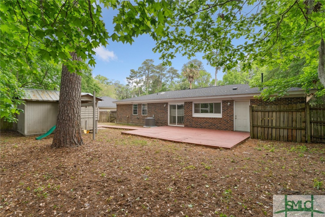 27 Davidson Avenue Savannah, GA 31419 - Photo 32 of 37 Backyard with Deck and Shed and Playset