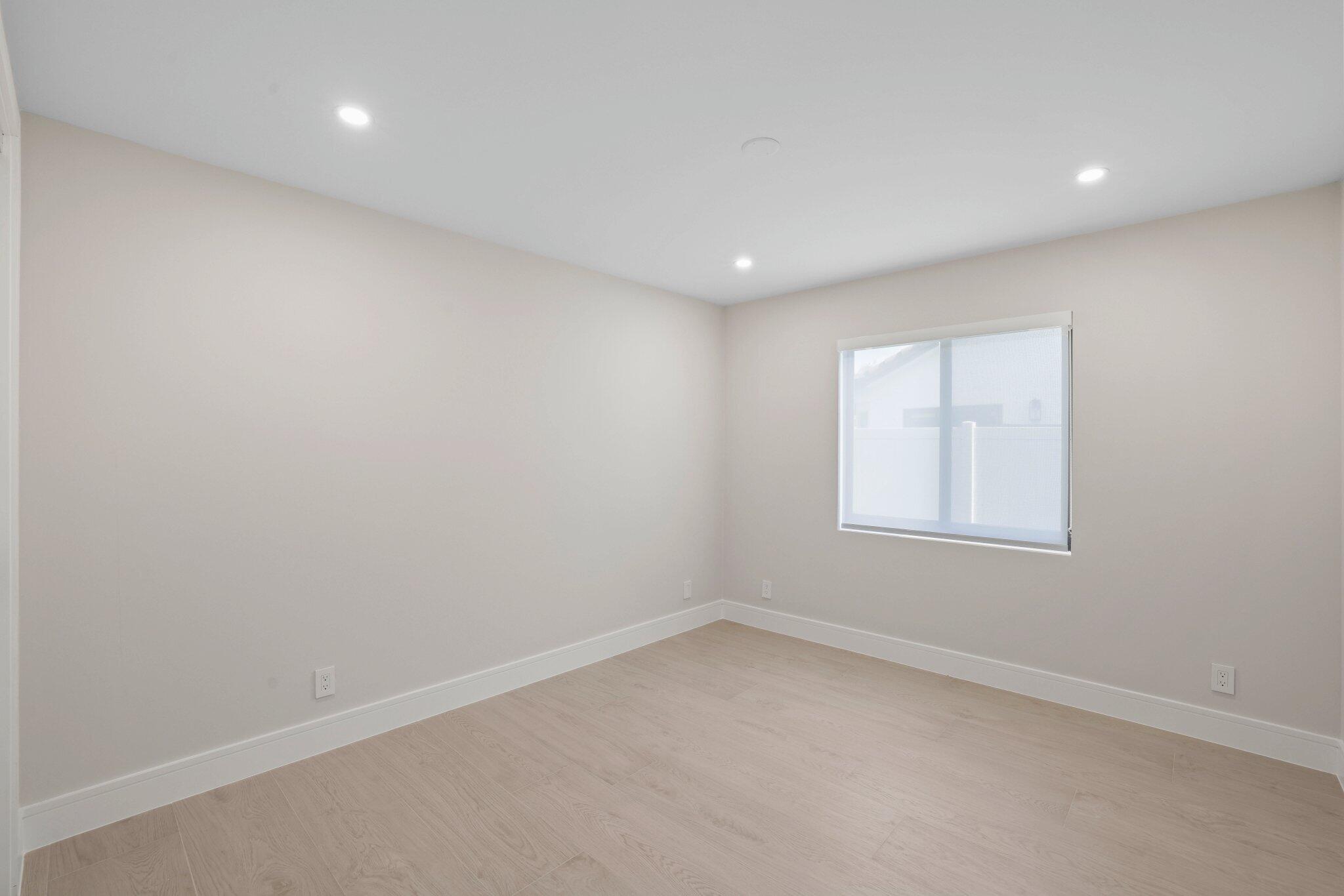 3901 Northwest 27th Avenue Boca Raton, FL 33434 - Photo 46 of 56 an empty room with a window