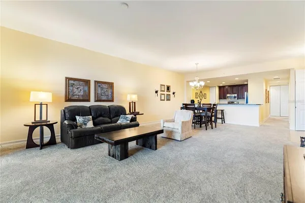 a kitchen with granite countertop a sink stove and refrigerator