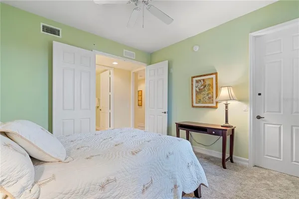 a bathroom with a granite countertop sink a mirror and a shower