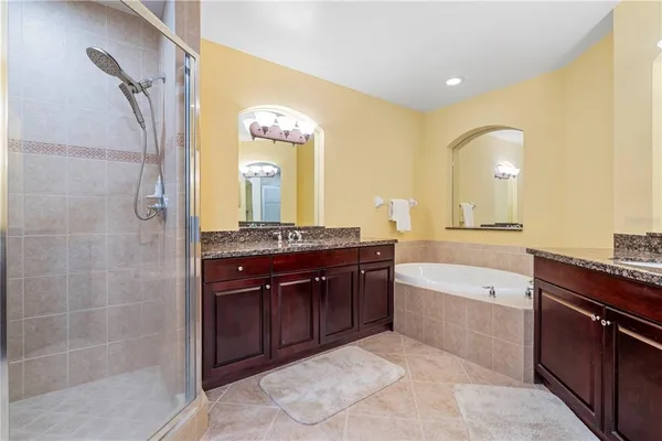 a spacious bedroom with a bed and a walk in closet