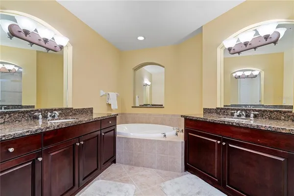 a living room with furniture and large windows