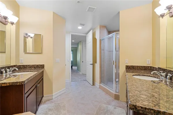 a dining room with furniture and a chandelier