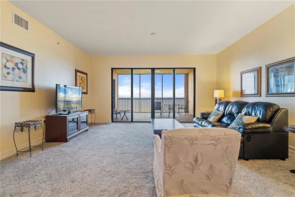 a view of a swimming pool with sitting area