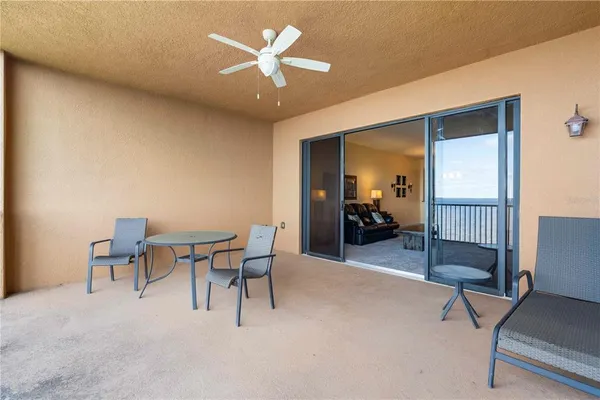 a view of a backyard with swimming pool