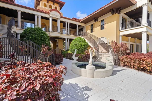 an aerial view of a house with a swimming pool and outdoor space