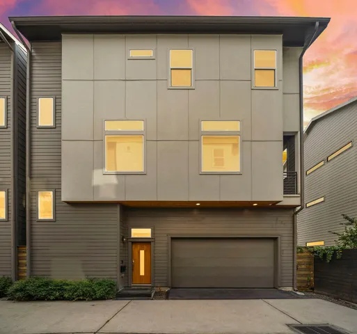 a front view of a building with a garage