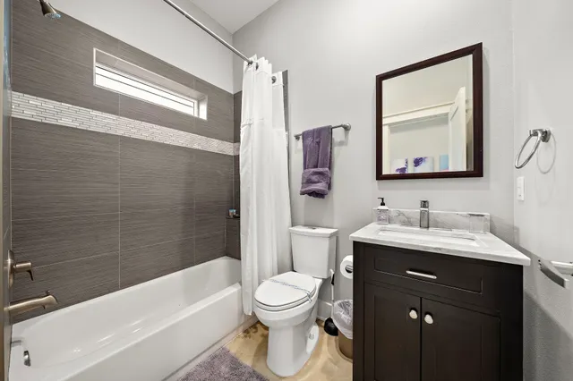 a bathroom with a toilet a sink and a bathtub