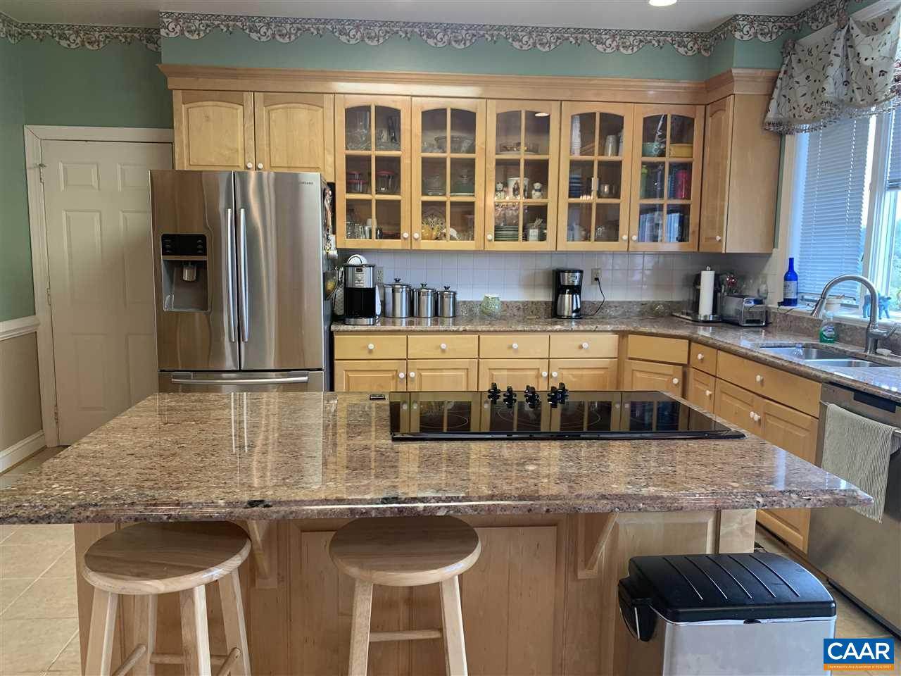 2072 Seville Road Madison, VA 22727 - Photo 14 of 37 a kitchen with stainless steel appliances granite countertop a sink and a refrigerator