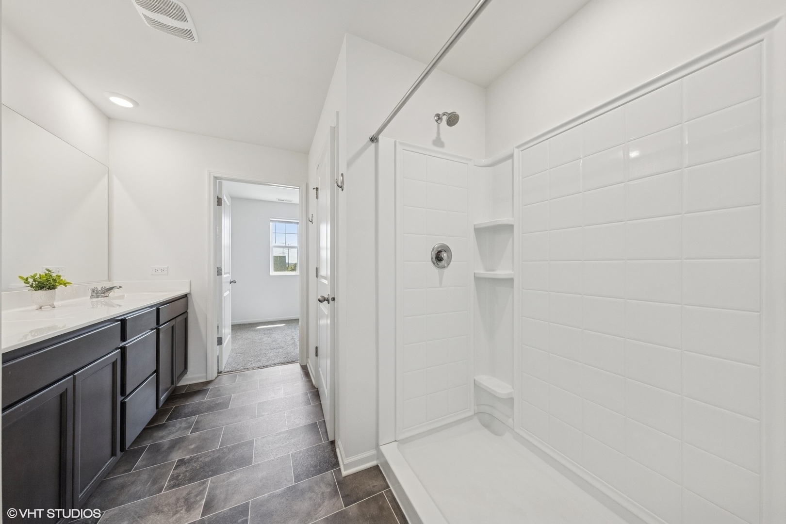 411 Stockton Drive Joliet, IL 60421 - Photo 12 of 29 a bathroom with a granite countertop sink a toilet and shower