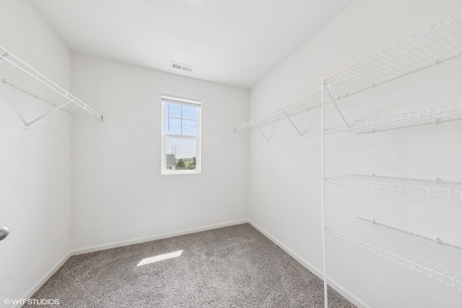 411 Stockton Drive Joliet, IL 60421 - Photo 13 of 29 a view of a small space with wooden floor and a window