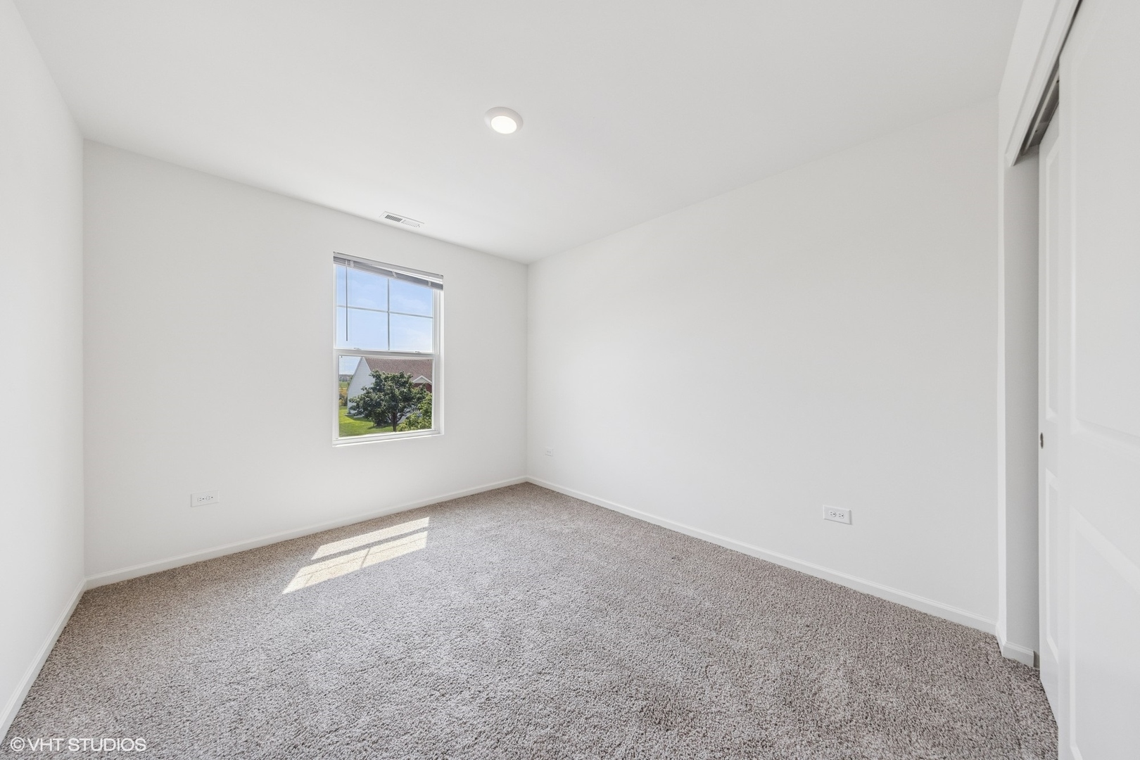 411 Stockton Drive Joliet, IL 60421 - Photo 17 of 29 an empty room with windows