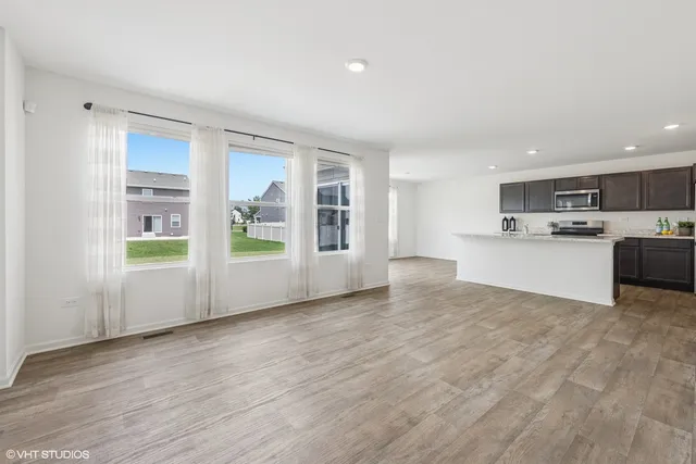 a view of a kitchen with a sink cabinets and a window