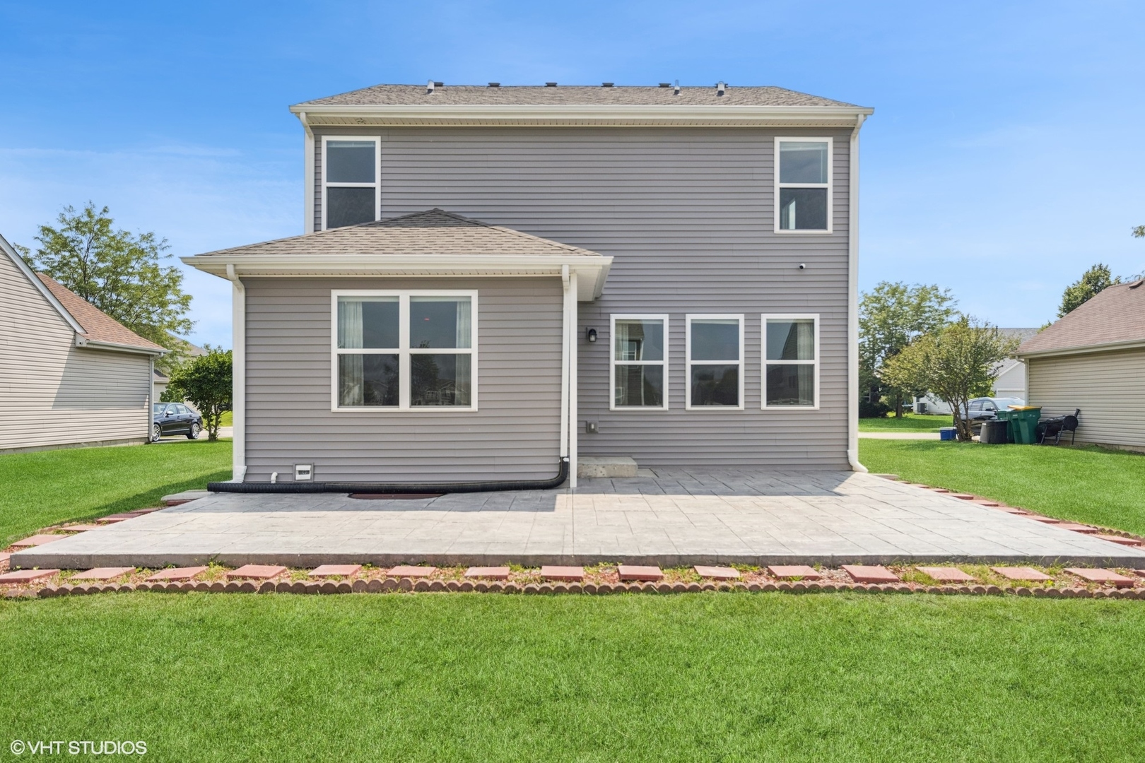 411 Stockton Drive Joliet, IL 60421 - Photo 24 of 29 a front view of a house with a yard and garage