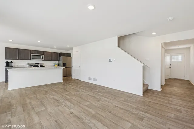 a view of a kitchen with a stove top oven