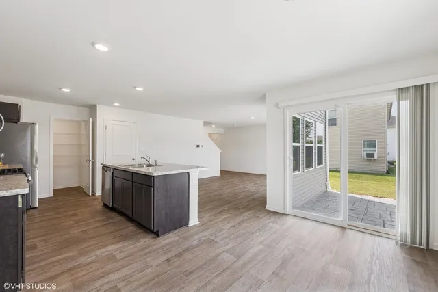 a view of kitchen with wooden floor