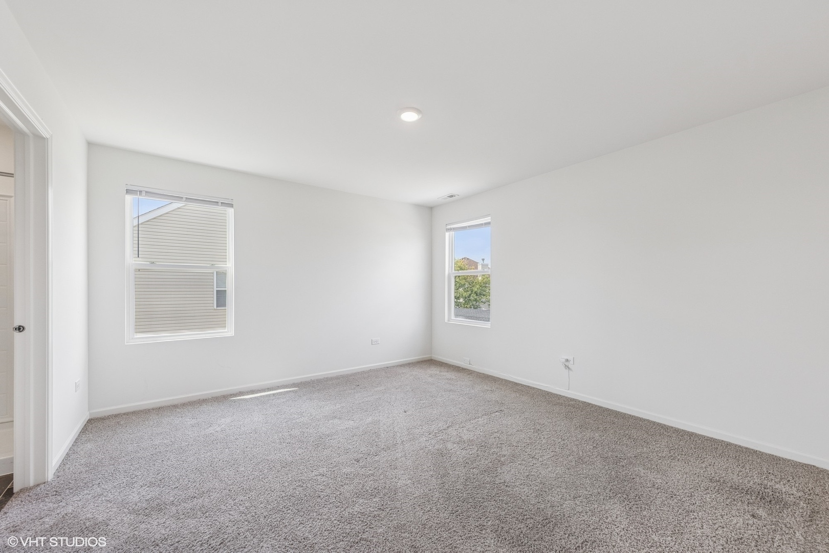 411 Stockton Drive Joliet, IL 60421 - Photo 10 of 29 an empty room with windows