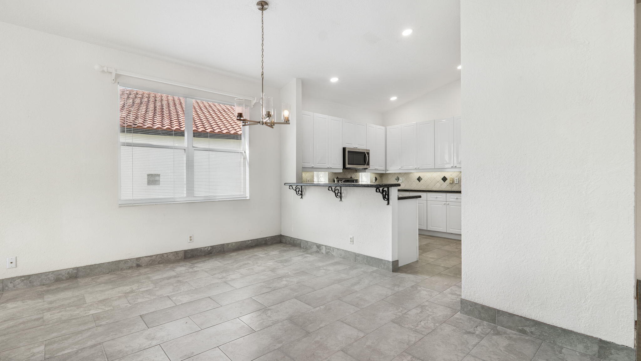 18718 Sea Turtle Lane Boca Raton, FL 33498 - Photo 37 of 62 Family Room/Kitchen