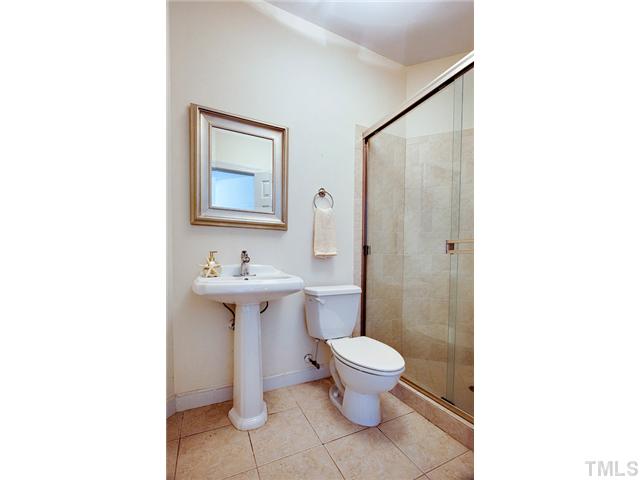 4617 Mentone Way Raleigh, NC 27612 - Photo 19 of 23 a bathroom with a sink toilet and shower