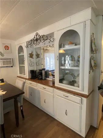 a kitchen with stainless steel appliances a window and cabinets