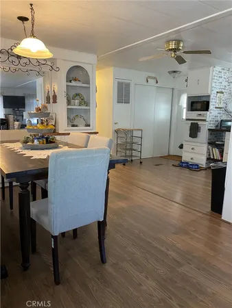 a living room with fireplace furniture and a chandelier