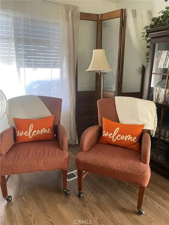 a bedroom with a bed and a lamp