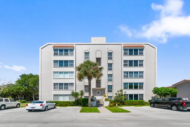 a front view of a building with street view