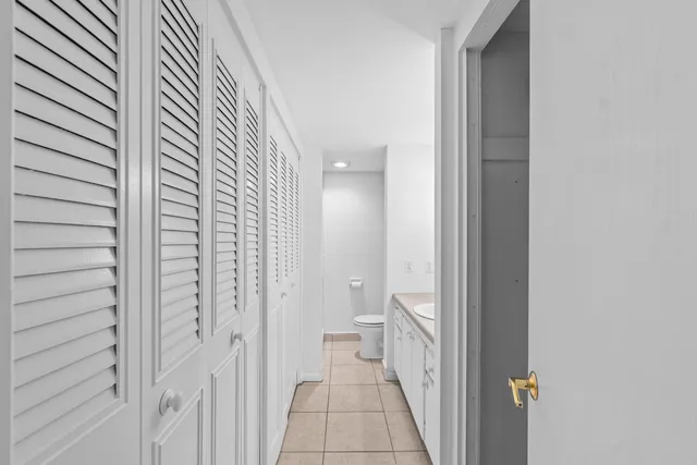 a view of a bathroom from a hallway