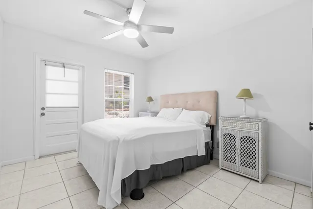 a bedroom with a bed and a table