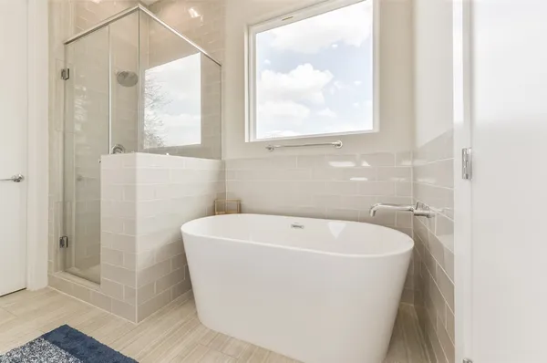 a white bath tub sitting next to a window