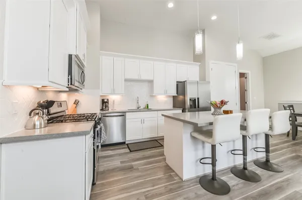 a kitchen with a sink cabinets and window