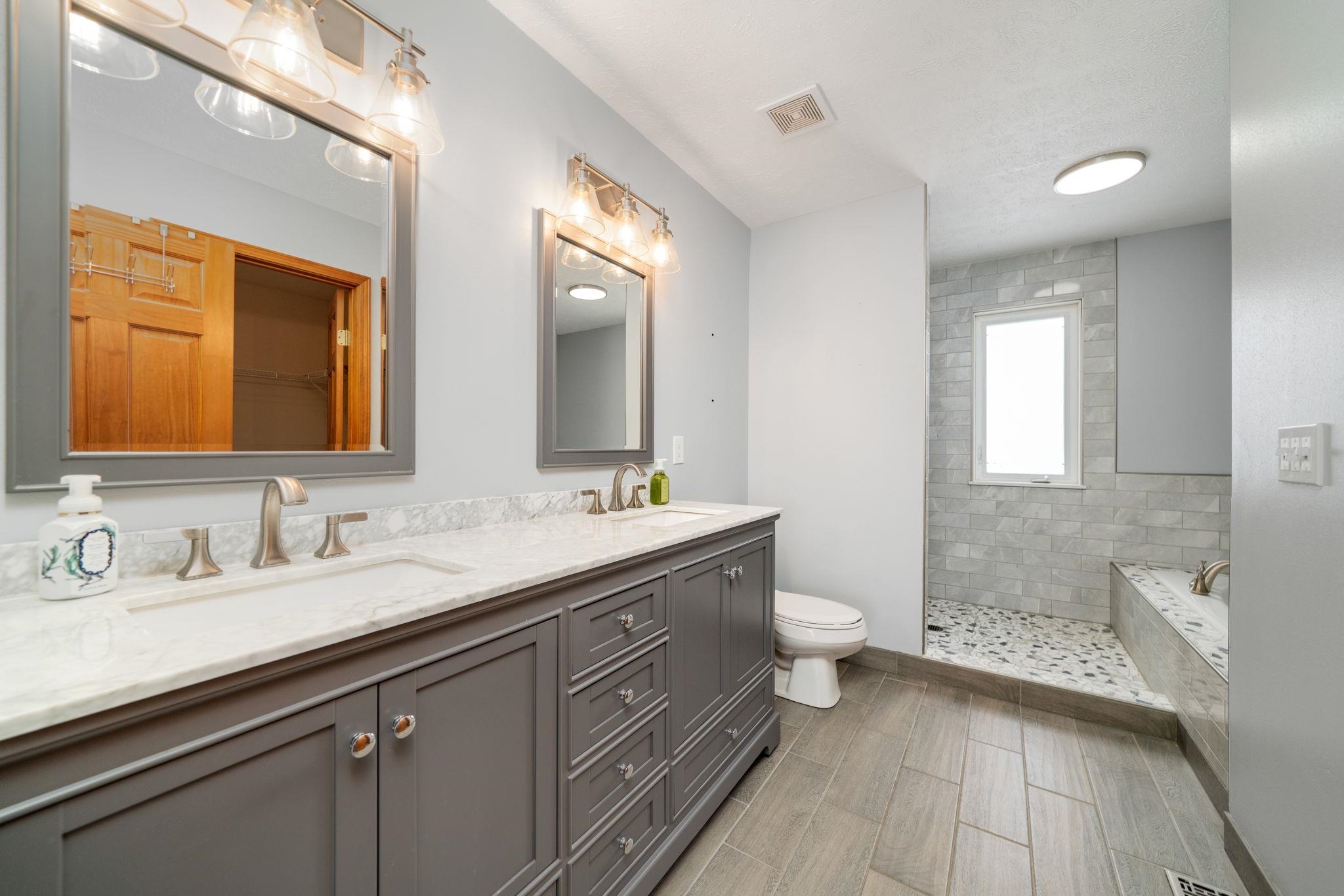 11062 Chicory Ridge Way Roscoe, IL 61073 - Photo 12 of 43 a bathroom with a double vanity sink and a mirror
