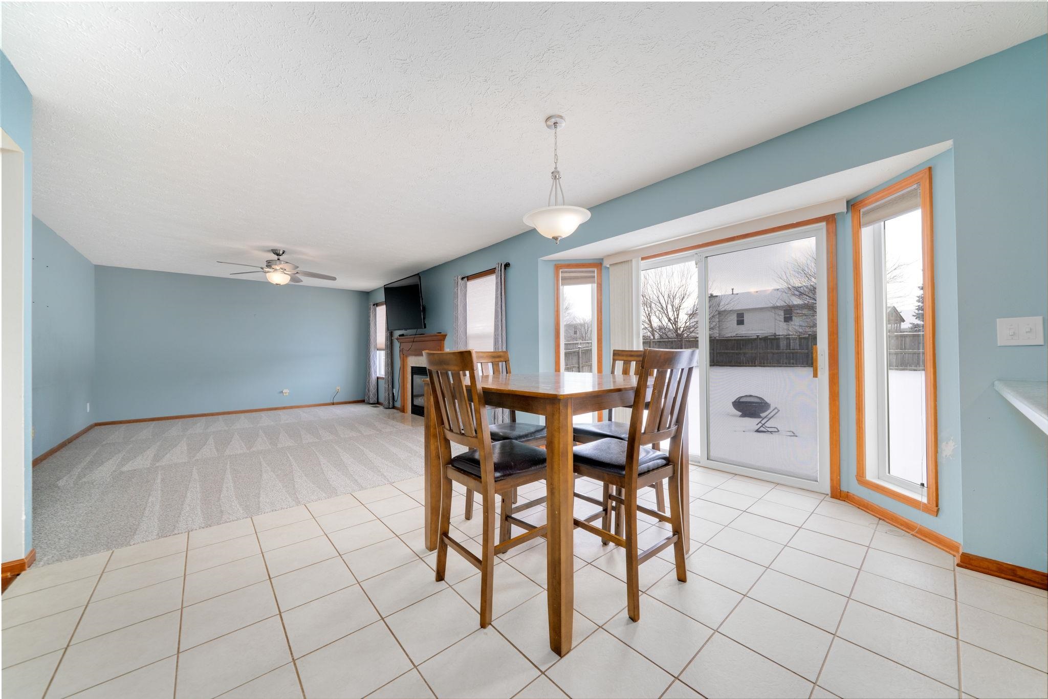 11062 Chicory Ridge Way Roscoe, IL 61073 - Photo 14 of 43 a view of a dining room with furniture window and outside view
