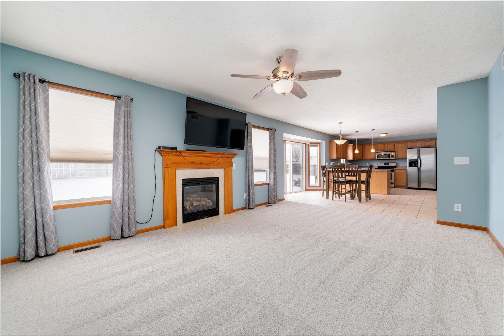 11062 Chicory Ridge Way Roscoe, IL 61073 - Photo 16 of 43 a view of livingroom with furniture fireplace and a window