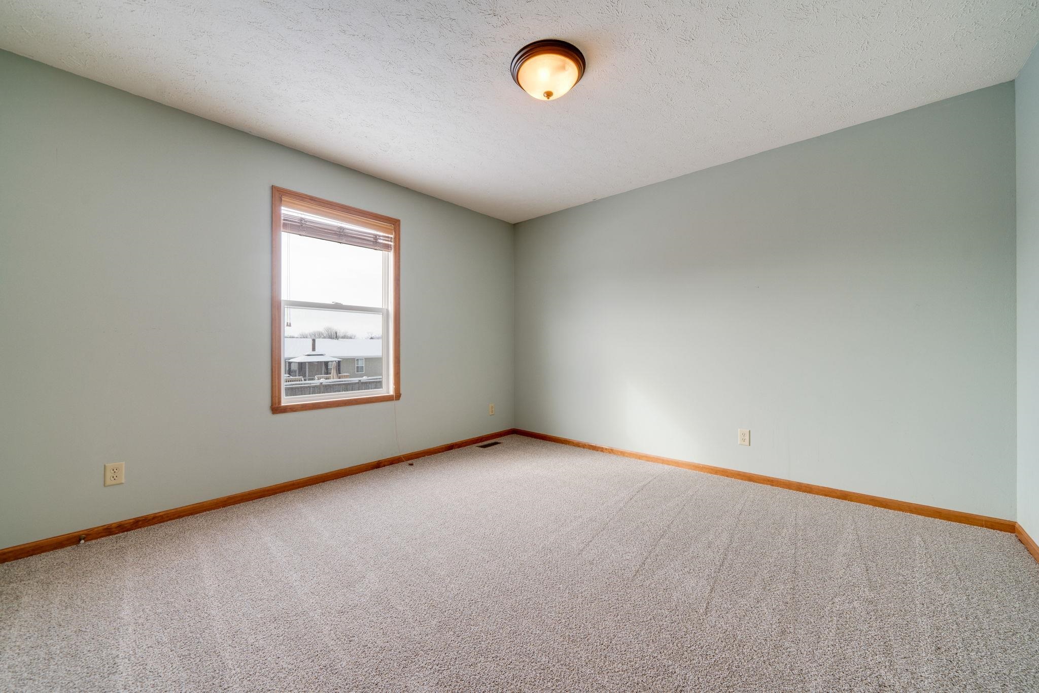 11062 Chicory Ridge Way Roscoe, IL 61073 - Photo 22 of 43 an empty room with a window