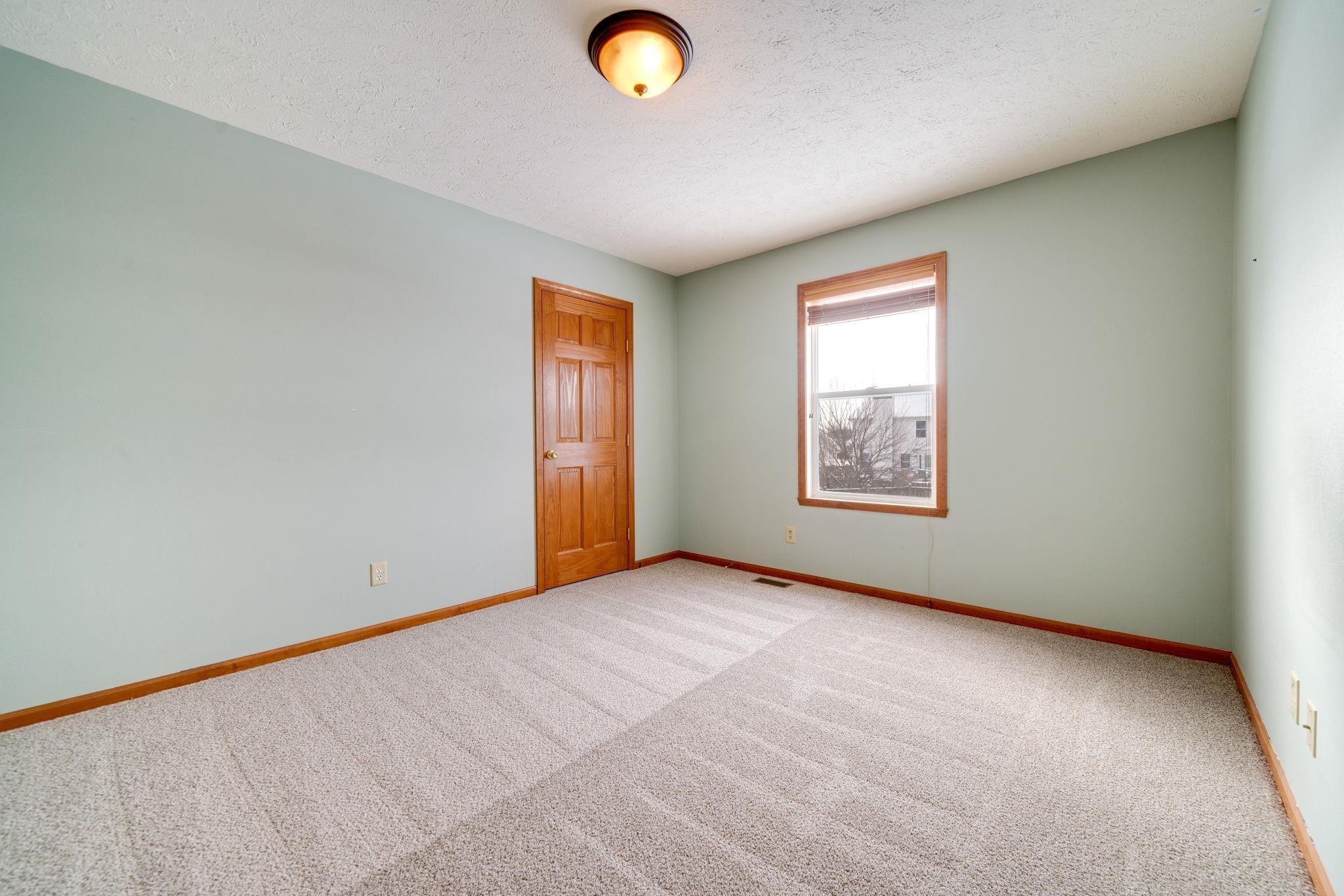 11062 Chicory Ridge Way Roscoe, IL 61073 - Photo 25 of 43 an empty room with windows and closet