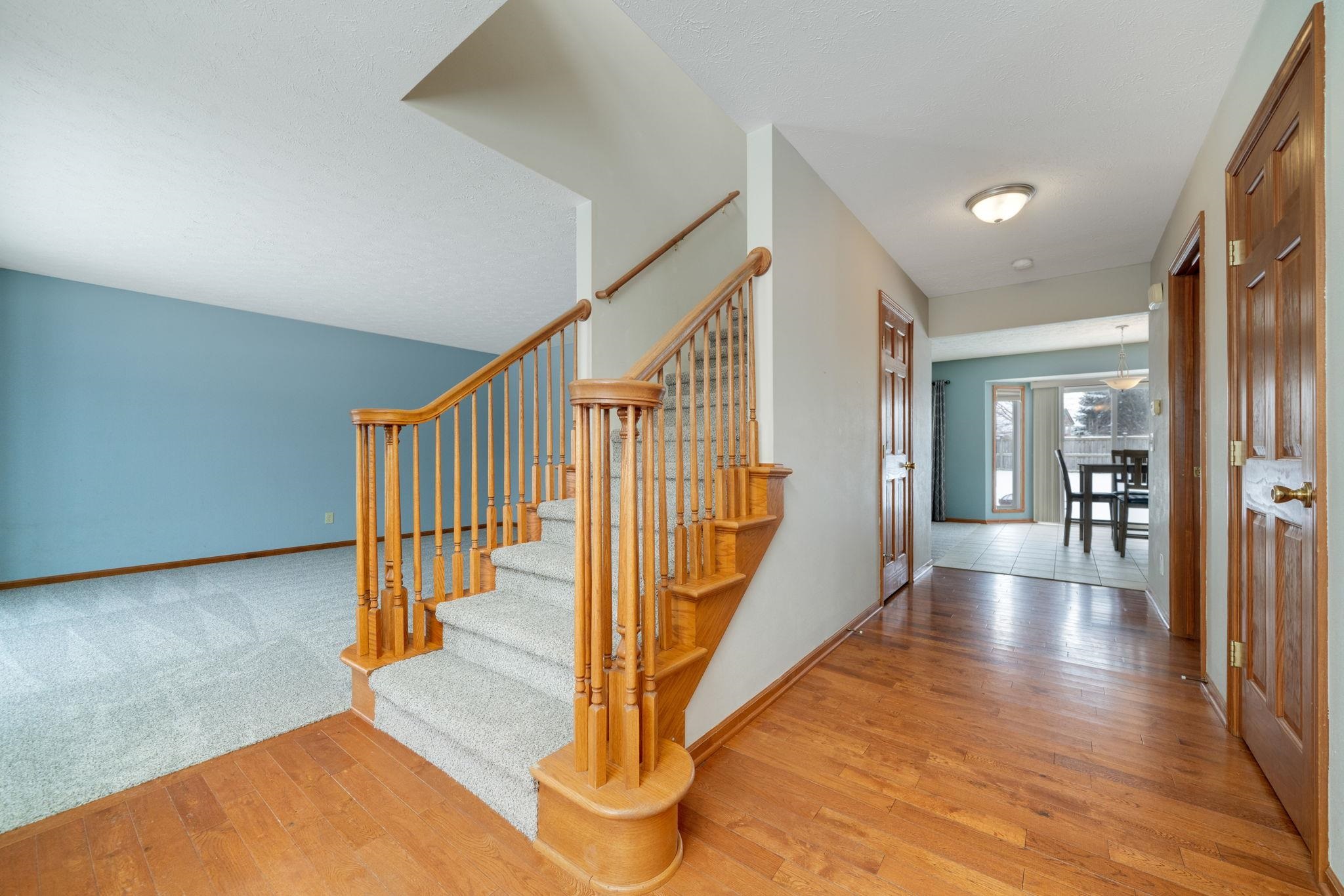 11062 Chicory Ridge Way Roscoe, IL 61073 - Photo 4 of 43 a view of a hallway with staircase