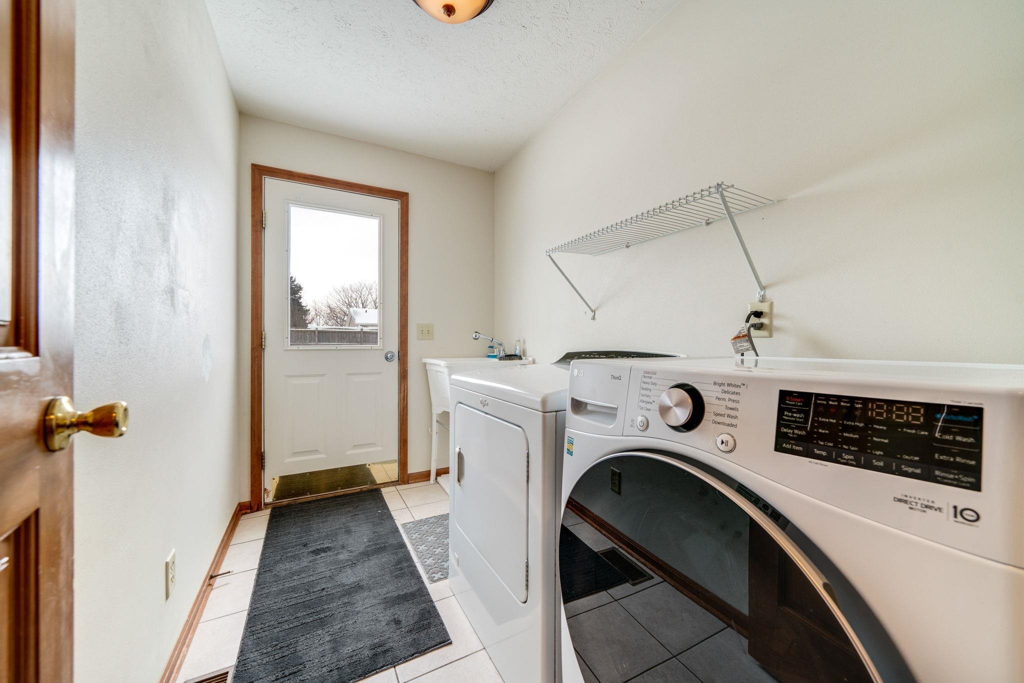 11062 Chicory Ridge Way Roscoe, IL 61073 - Photo 8 of 43 a view of livingroom with washer and dryer