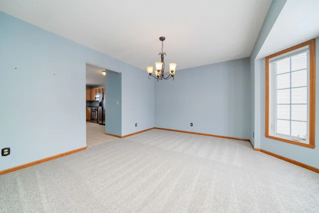 a view of a room with window and stairs