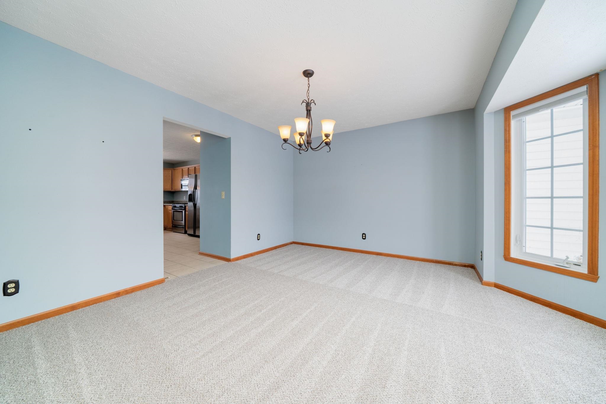 11062 Chicory Ridge Way Roscoe, IL 61073 - Photo 8 of 43 a view of a room with window and stairs
